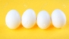 Four Eggs Isolated On Yellow Background Stock Photo, Picture And Royalty  Free Image. Image 11174334.